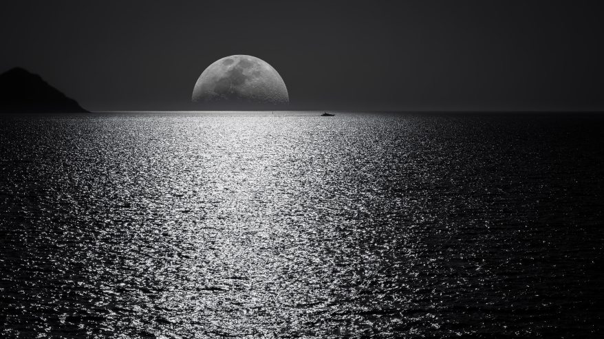white-and-black-moon-with-black-skies-and-body-of-water-748626